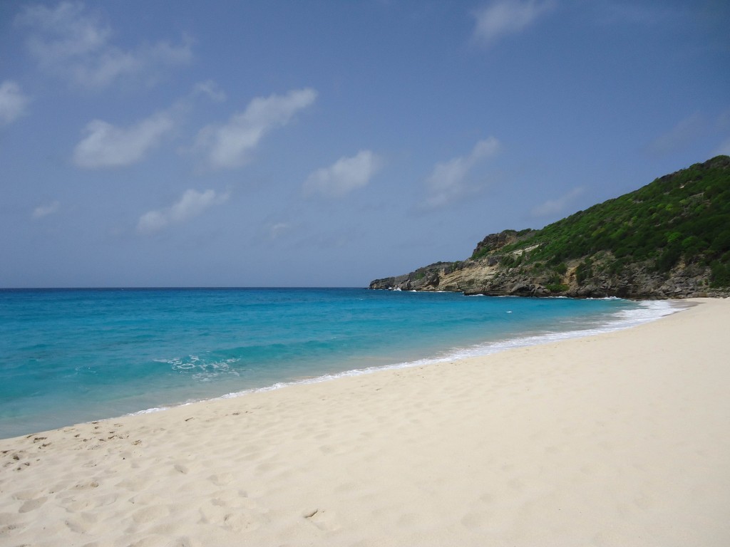 Gouveneur Beach with white powdery sand and a vast blue horizon