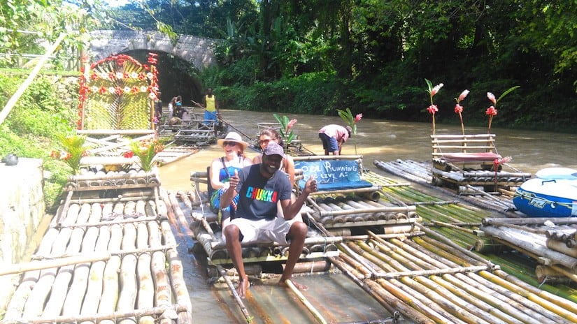 Noreen and Emma ready to push off on Captain Noel's Bamboo raft on the Great River in Jamaica