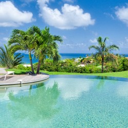 Pool, shade, and sundeck at a beach front villa in St Martin