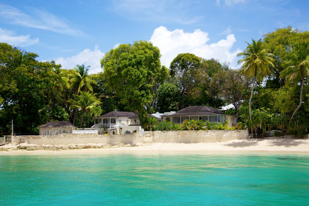 Landfall villa sitting right on the white sandy beach