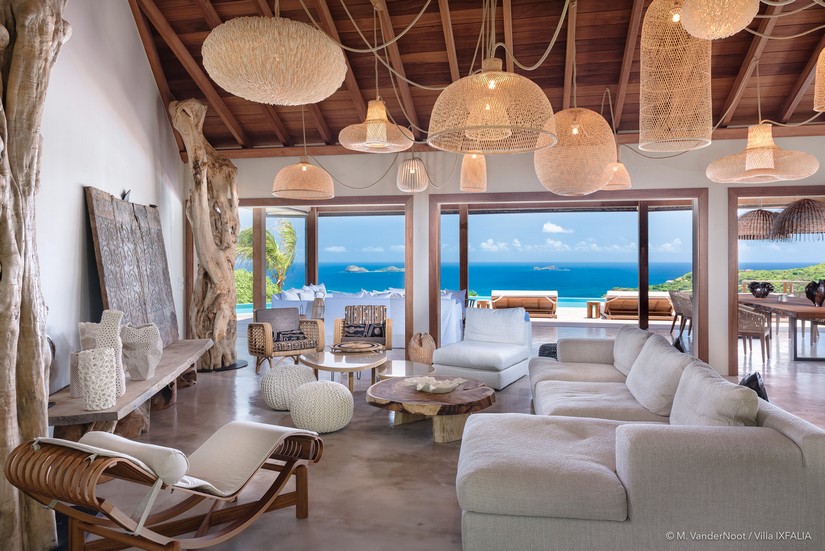 Pastel toned living area with sea horizons at Ixfalia