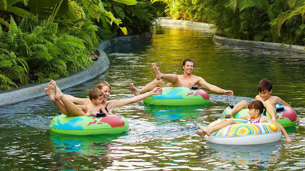 Family Fun at the Four Seasons A family on inflatable rings floats down the Lazy River at the Four Seasons Resort at Punta Mita