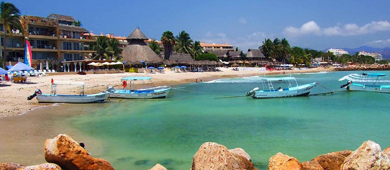 The Village, Punta Mita Boats anchored at the beach by the Village at Punta Mita