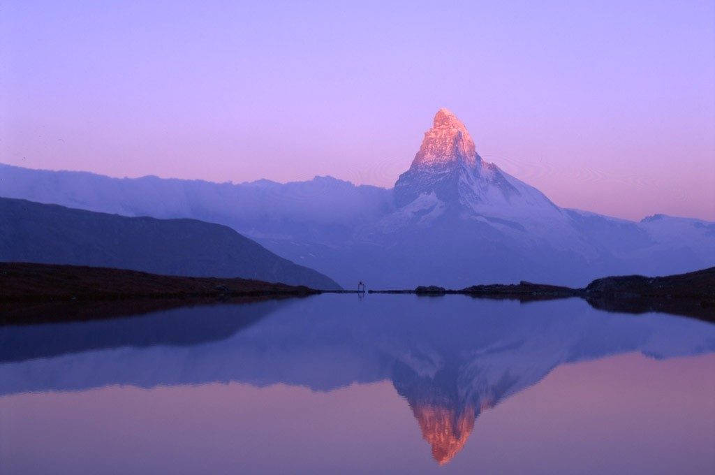 The Sun sets on the Matterhorn the peak of the Matterhorn rendered a delicious pink hue by the setting Sun