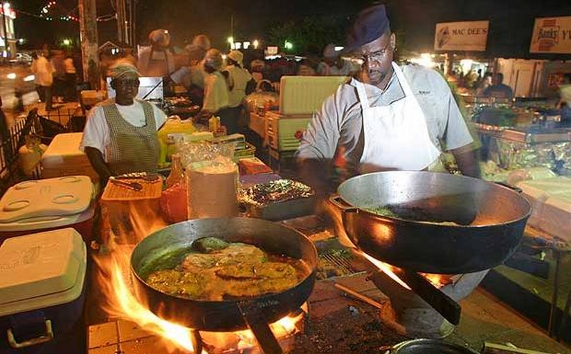 Capable chefs cook up an authentic Bajan fishy feast at the Oistins fish fry. Huge pots and pans bubble and simmer enticingly in a cramped street kitchen. The bustling crowd of onlookers are ready and eager to eat.