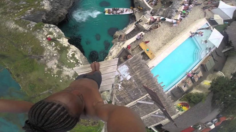 Image of a horrifyingly high jump point into the sea at Rick's Cafe in jamaica. Do it! Do it! Do it!