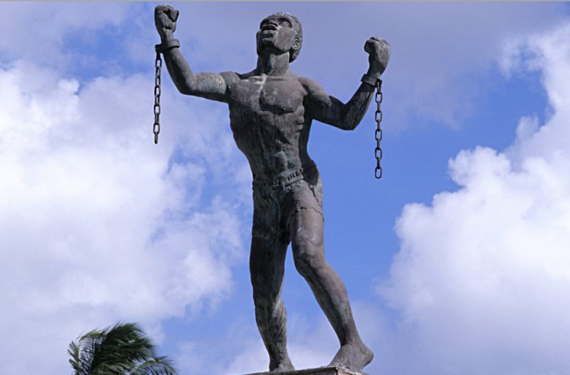 Emancipation Statue that depicts a slave breaking his chains during Barbados slave trade.  