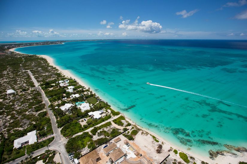 Ariel shot of Grace Bay in Turks and Caicos - Vast Turquoise waters and Sandy shores 