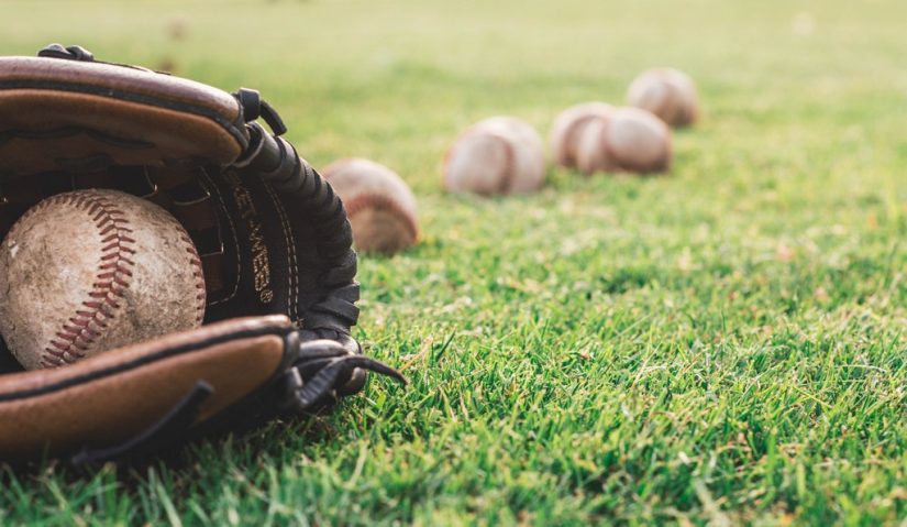 Kids playing baseball in a field in the dominican republic