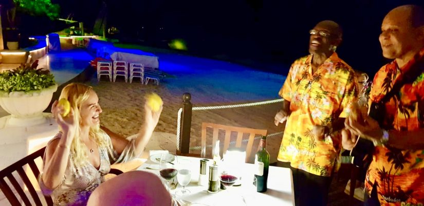 Alex waves lemons at two unsuspecting musicians at the Bajan Blue restaurant in Barbados