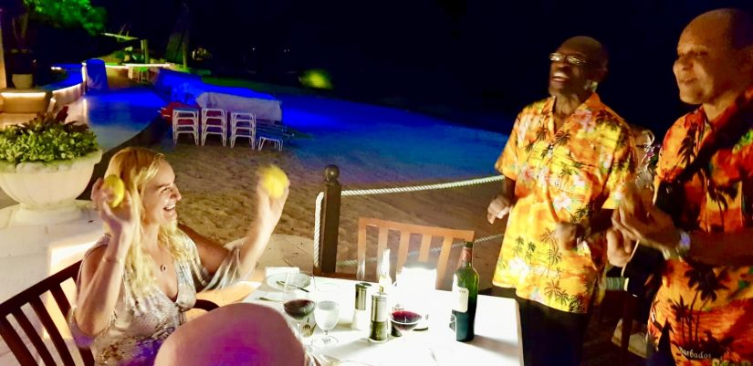 Alex waves lemons at two unsuspecting musicians at the Bajan Blue restaurant in Barbados