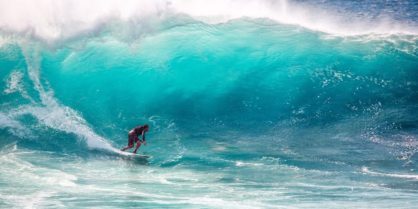 I'm definitely going to make it A surfer braves an epic crashing wave