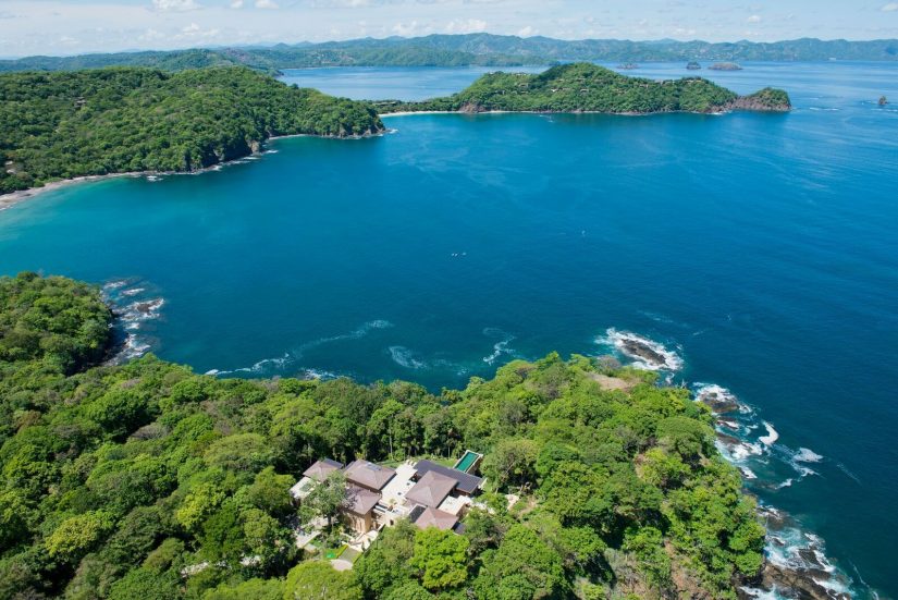 Aerial view of Villa Manzu set among the insanely green forest