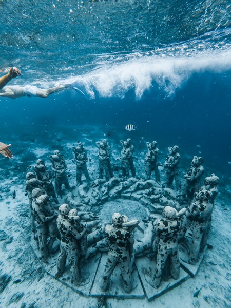 Delve into the crystal-clear turquoise waters and experience this peaceful underwater museum One of the best vacation spots in mexico is Cancun for its captivating underwater Museum experience