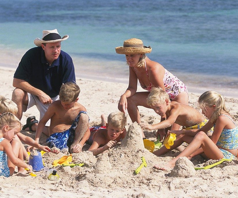 kids playing on the beach at half moon resort in jamaica