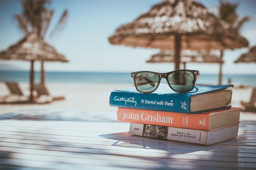 Sunglasses and books on the beach