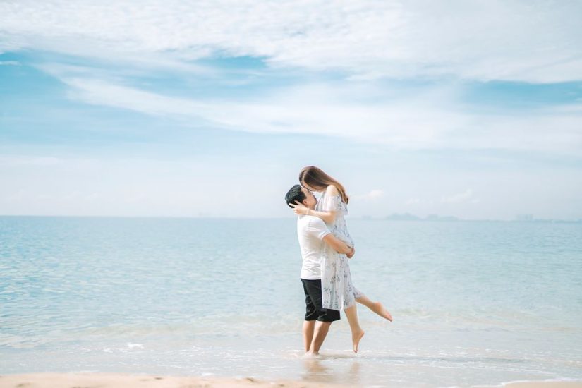 Honeymoon in costa rica couple hug on sandy beach