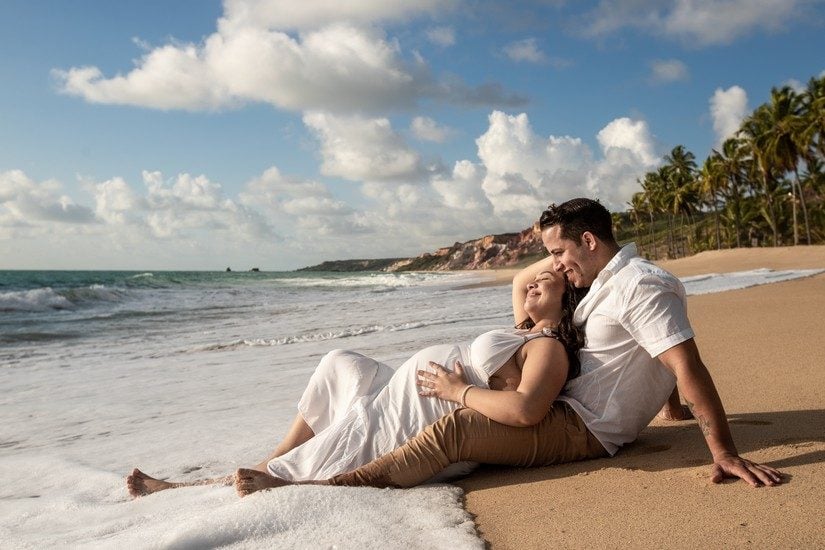 couple on the beach babymoon destinations