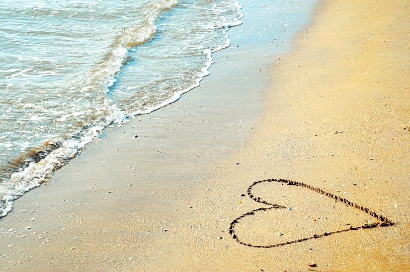 heart on the beach for a babymoon vacation