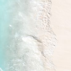 couple on a beach best babymoon destinations