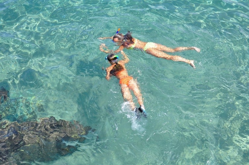 Two ladies snorkeling in Anguilla one of the best things to do