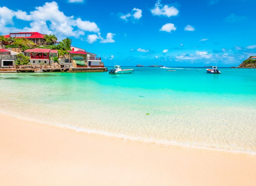 a stunning beach in St barts, a beautiful place to go in 2024