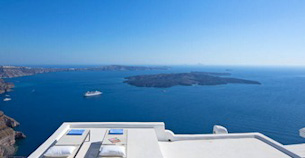 View across the caldera at Santorini from atop a whitewashed villa