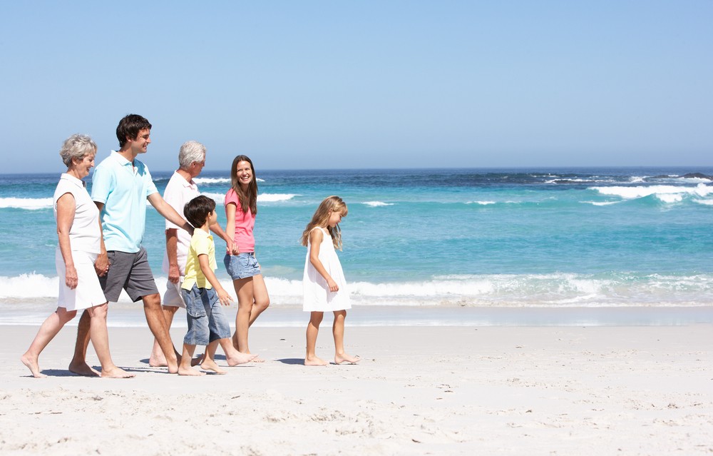 A family having fun on the beach at choc bay