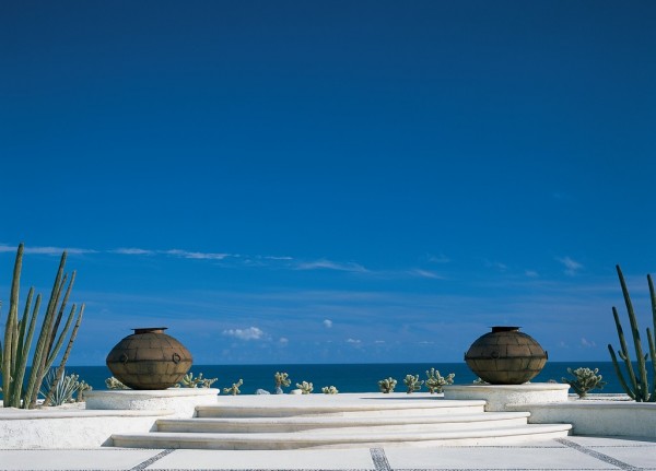 View of the ocean from across the patio of a Mexican Villa