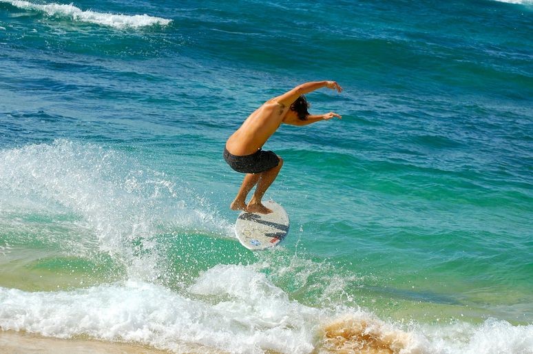 Surfer on Poipu Beach