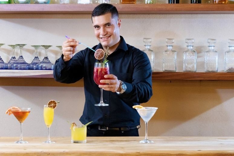 the butler at villa alexa in Mexico preparing drinks