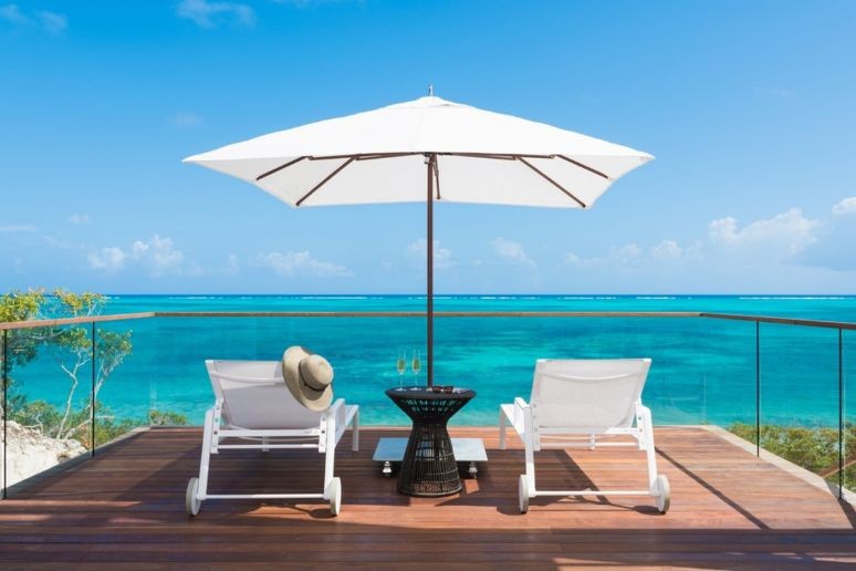Two deck chairs with drinks at Beach Enclave Turks and Caicos