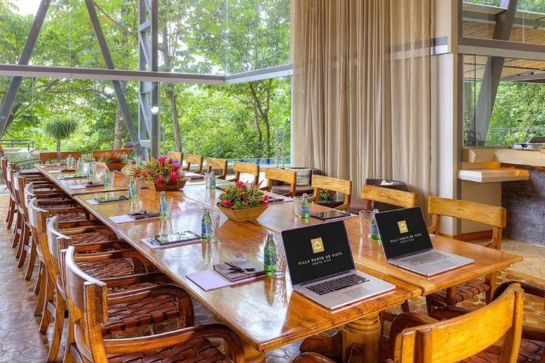 Dining table with computers at a villa in Costa Rica
