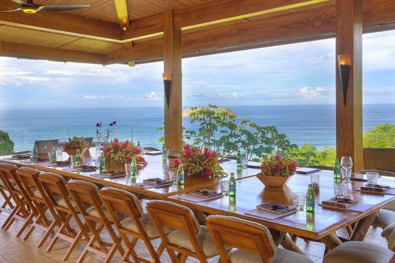 A dining area with notebooks suitable for a corporate retreat