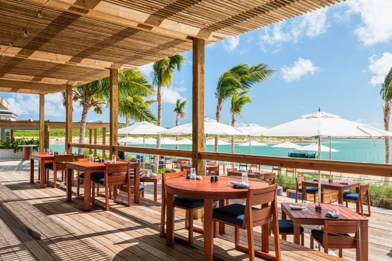 A dining area overlooking the ocean at Ambergris Cay