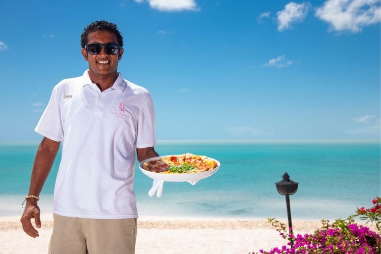 A waiter serving snacks at Sailrock