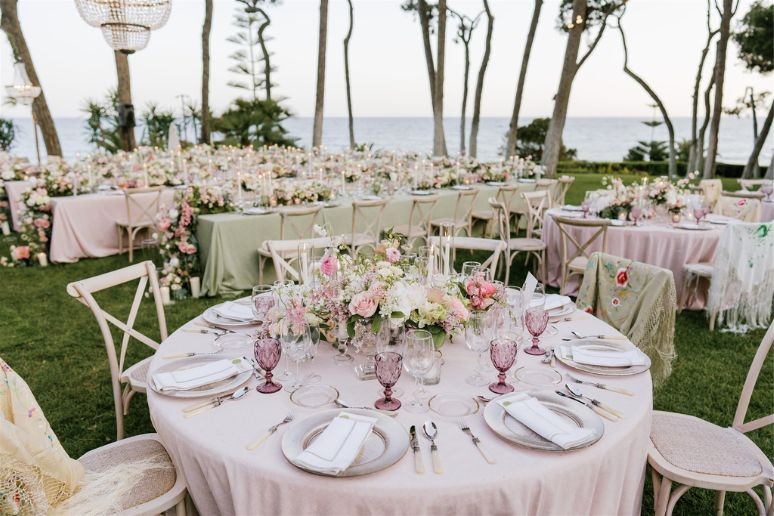 a table with flowers at a wedding reception
