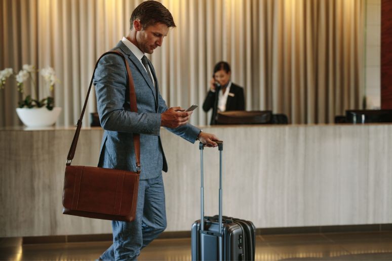 A man standing in a lobby