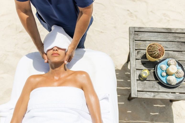 A lady getting a facial at Ambergris Cay