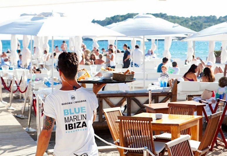 The Blue Marlin Ibiza restaurant.  Parasols, sunshine and handsome waiters