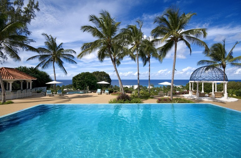 View of the Pool, Gardens, and Garden Bar at Dtanford House in Polo Ridge