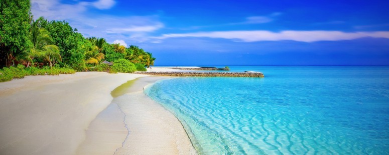 Getting to the bahamas and arriving at a very long white sandy beach next to a shockingly blue stretch of sea