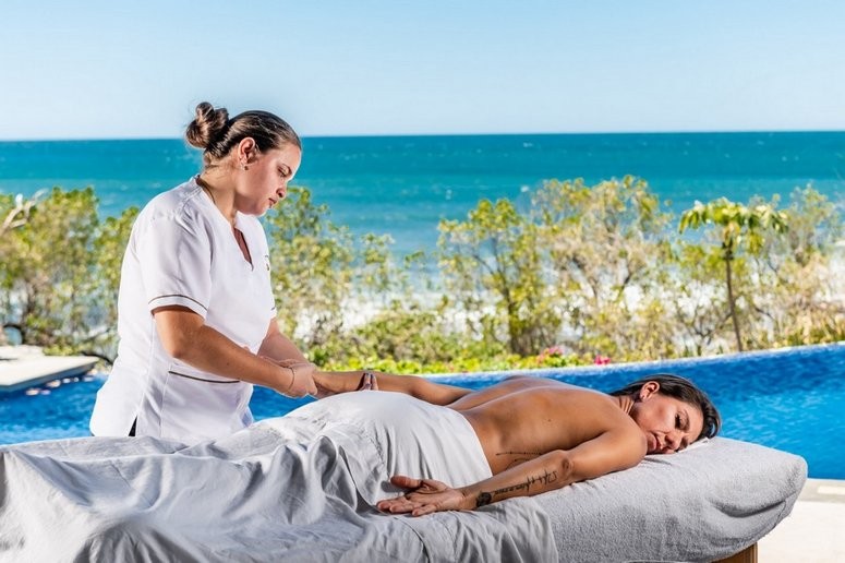 A traveller gets massaged at Tamarindo