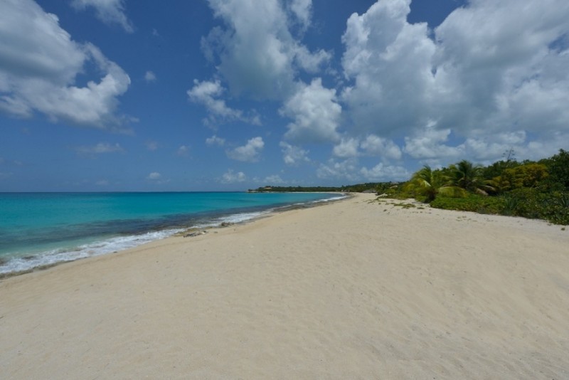 St Martin Beaches - Plum Bay exposes it's soft, powdery white sand to the blue sky overhead