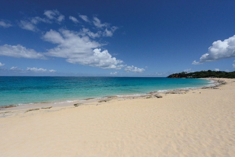 Baie Rouge sandy beach sees the sea disappear in to the distance