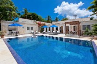 Astonishingly blue pool and parasol covered sunloungers at Todmorden Villa