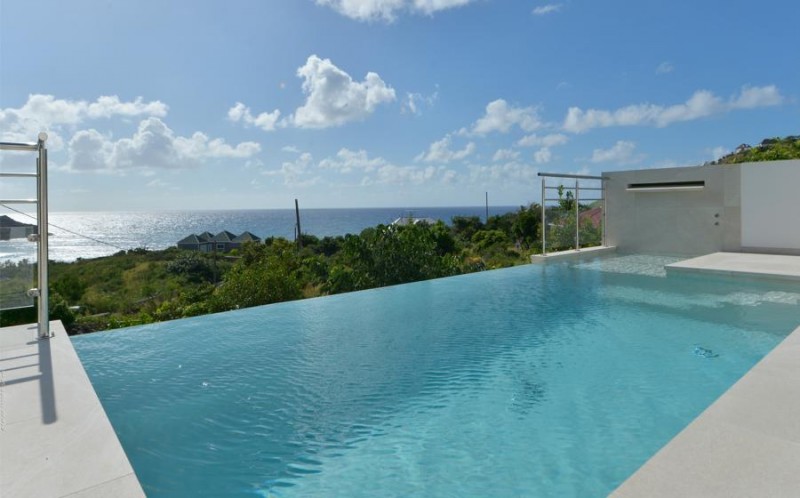 pool with sea in the background