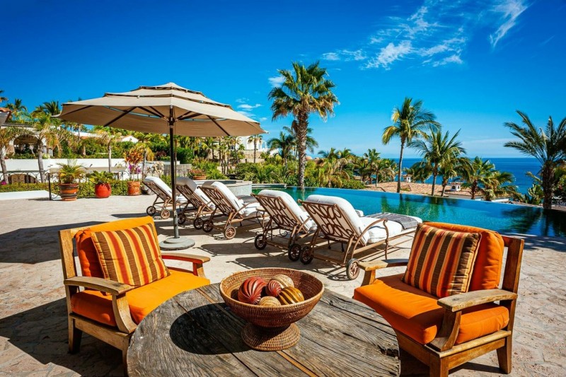 Lounge area by the pool at Casa de las Risas in Palmilla