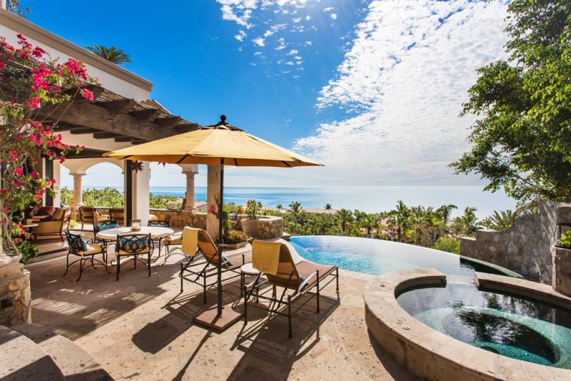 View of the pool and outdoors jacuzzi area overlooking the s