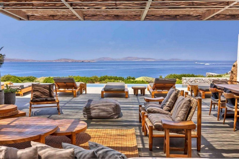 Open air sitting & dining area with views at Chantal Mykonos